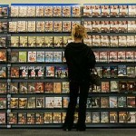 A customer looks at a selection of films for at the Blockbuster Video